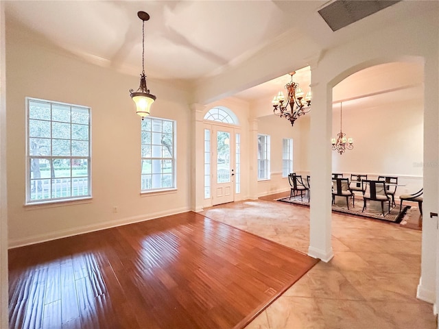 foyer entrance with a chandelier