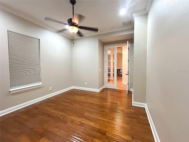 empty room featuring ceiling fan, dark hardwood / wood-style flooring, and french doors