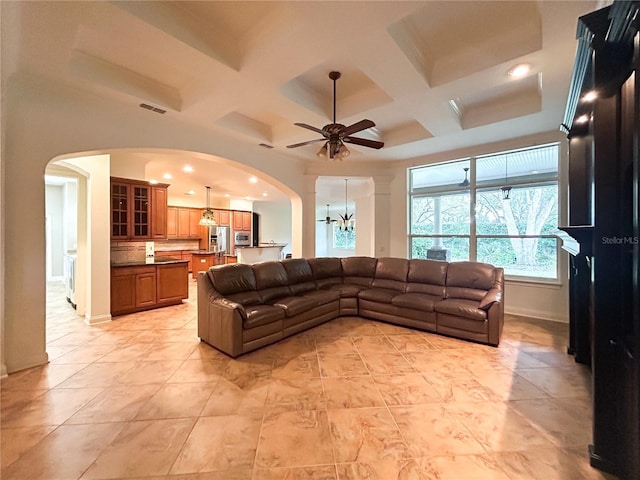 tiled living room featuring beam ceiling, ceiling fan, and coffered ceiling