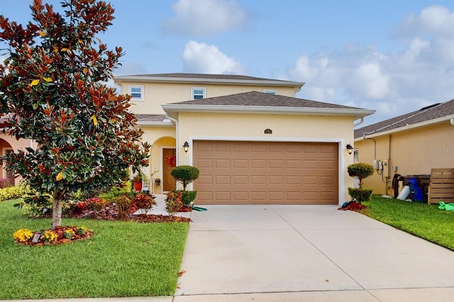 view of front of property with a front yard and a garage