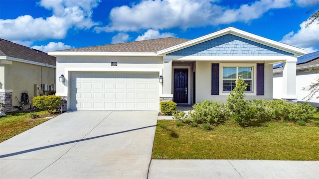 ranch-style house featuring a garage and a front lawn