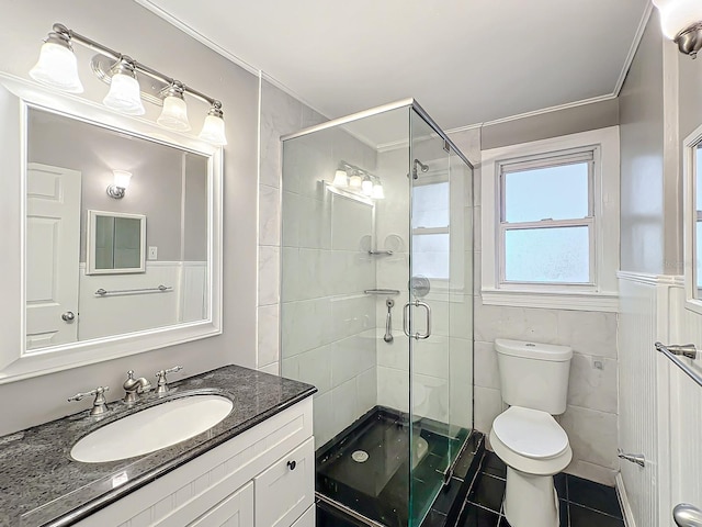 bathroom featuring walk in shower, tile walls, toilet, vanity, and tile patterned floors