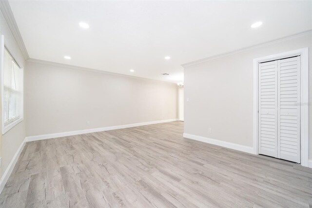 interior space with light hardwood / wood-style floors and ornamental molding
