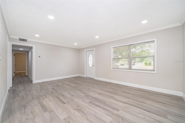 unfurnished room with crown molding and light wood-type flooring