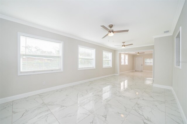spare room with crown molding, a healthy amount of sunlight, and ceiling fan
