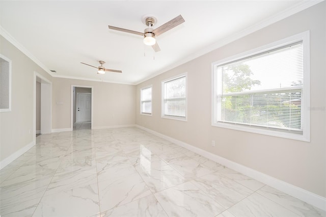 empty room featuring ceiling fan and ornamental molding