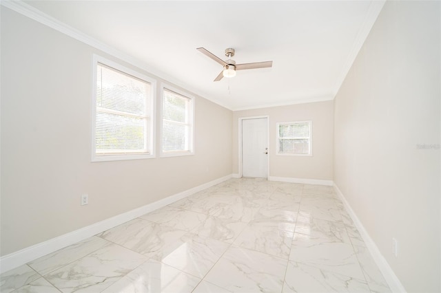 spare room featuring ornamental molding and ceiling fan