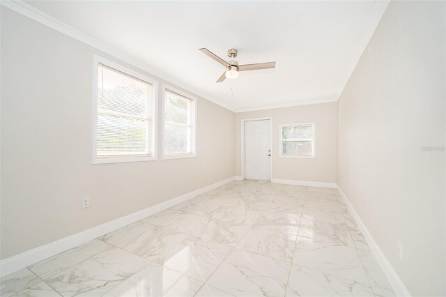 3703 Wade Rd, Orlando, FL 32808 - empty room with ornamental molding, plenty of natural light, ceiling fan, baseboards, and light marble finish floors