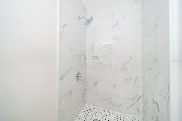 bathroom with a tile shower