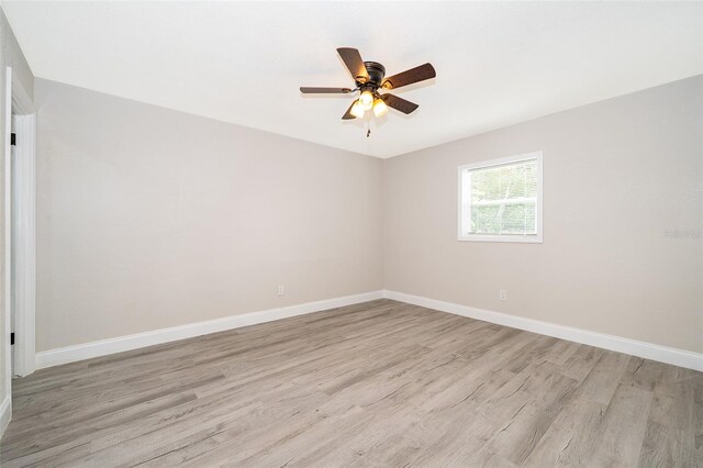 spare room with light hardwood / wood-style floors and ceiling fan