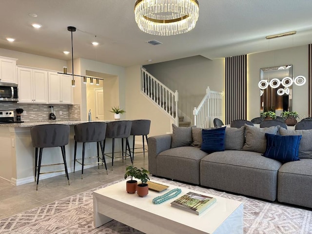 living room with an inviting chandelier