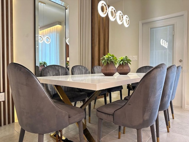 dining area featuring light tile patterned floors