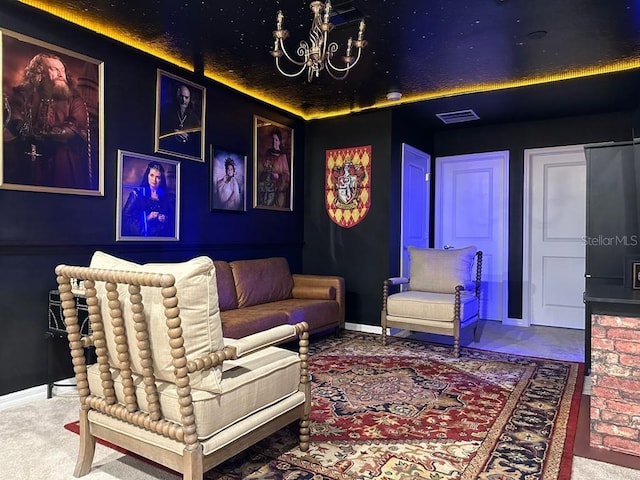 home theater with a notable chandelier