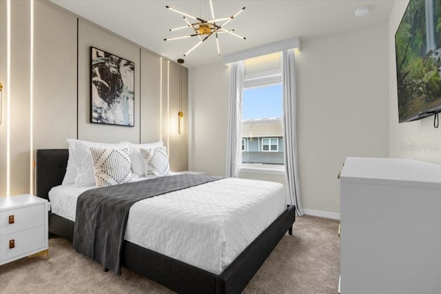 carpeted bedroom with an inviting chandelier