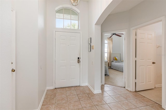 tiled entryway featuring a healthy amount of sunlight