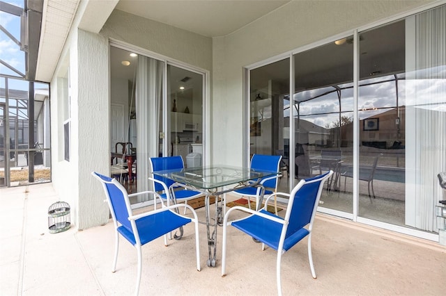 view of patio / terrace with glass enclosure