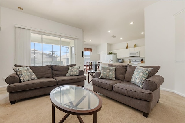 living room featuring light carpet