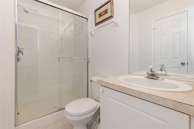 bathroom with vanity, a shower with shower door, and toilet