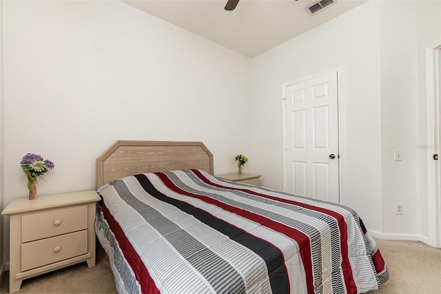 bedroom featuring light carpet and ceiling fan