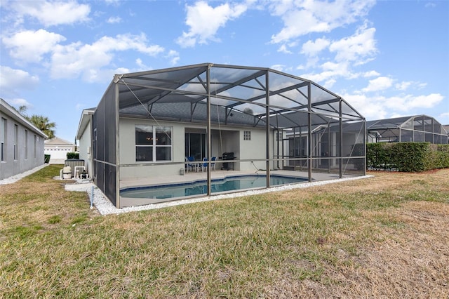 back of house with a yard and a patio