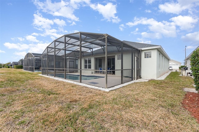 back of property with a patio area and a lawn