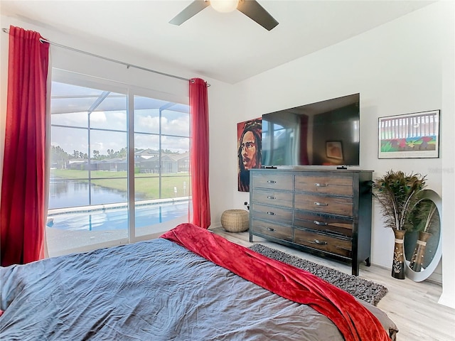 bedroom featuring access to exterior, light hardwood / wood-style flooring, and ceiling fan