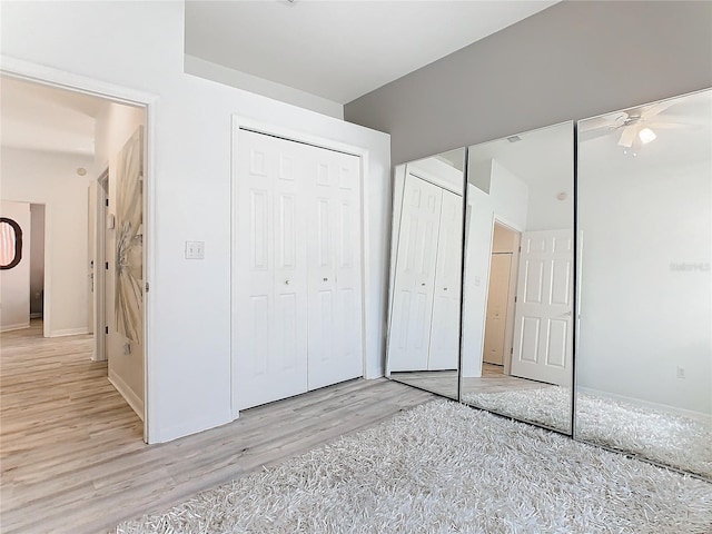 unfurnished bedroom featuring light wood-type flooring