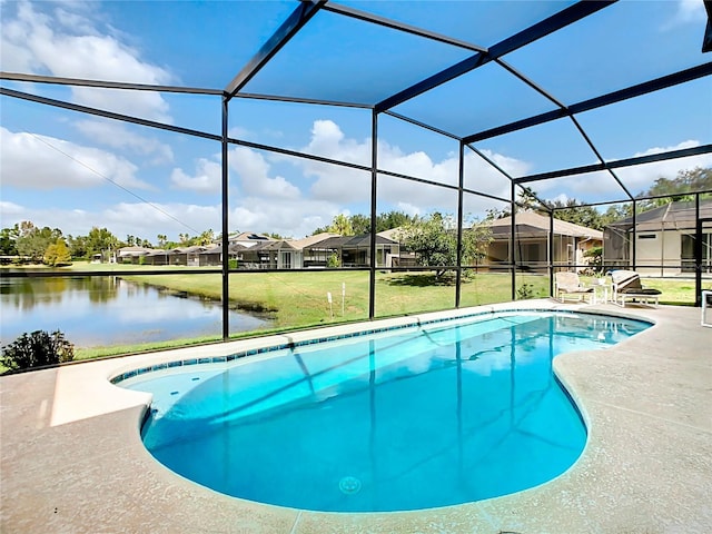 view of swimming pool featuring a yard, a water view, glass enclosure, and a patio area