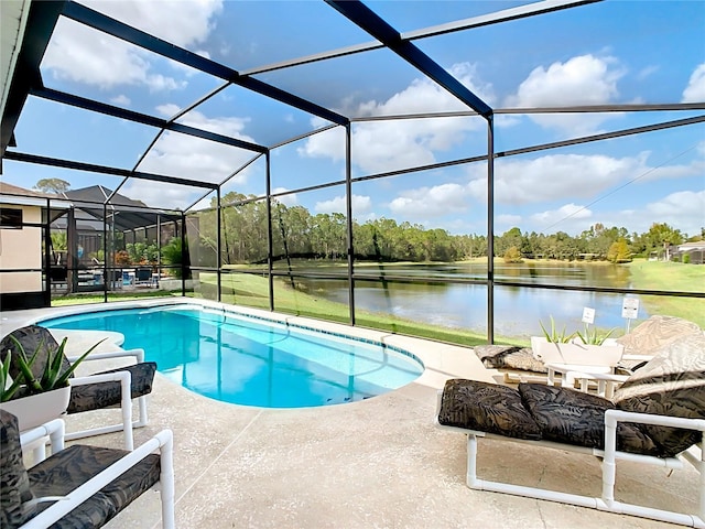 view of swimming pool featuring glass enclosure, a water view, and a patio