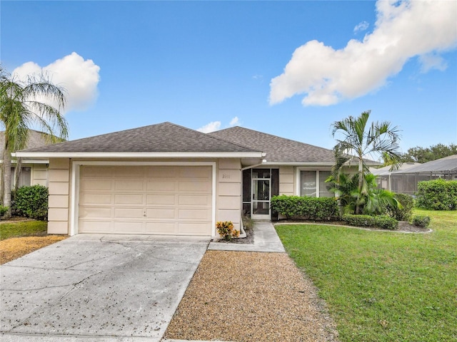 single story home with a garage and a front lawn