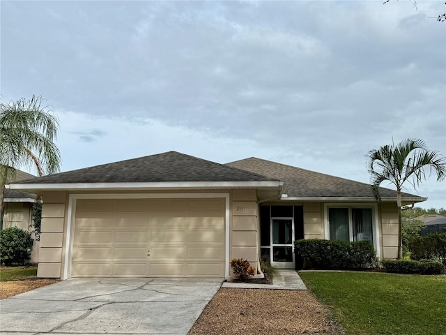 single story home with a garage, driveway, a front lawn, and roof with shingles