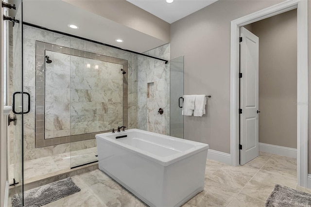 bathroom featuring separate shower and tub