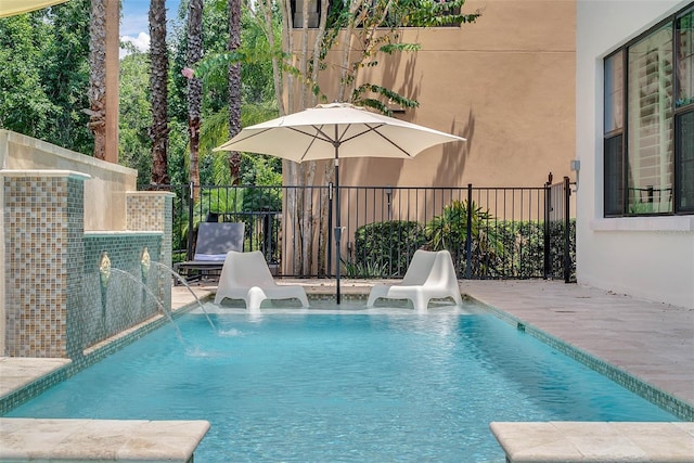 view of swimming pool featuring a patio area and pool water feature