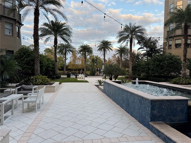 view of property's community with a patio and a swimming pool