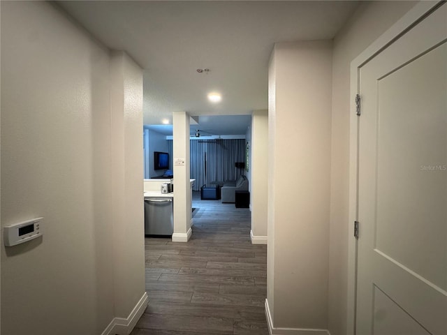 hallway with dark hardwood / wood-style flooring