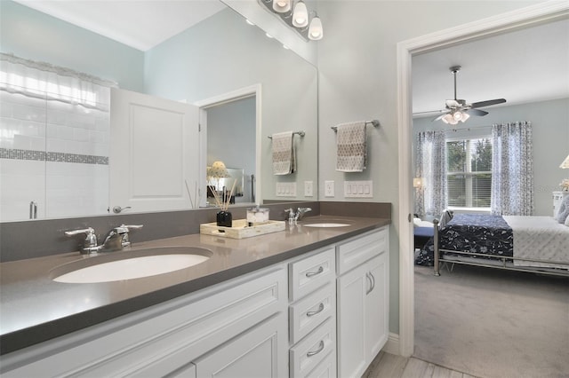 bathroom featuring vanity, a shower, and ceiling fan