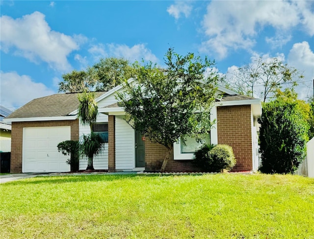 view of front facade with a front yard and a garage