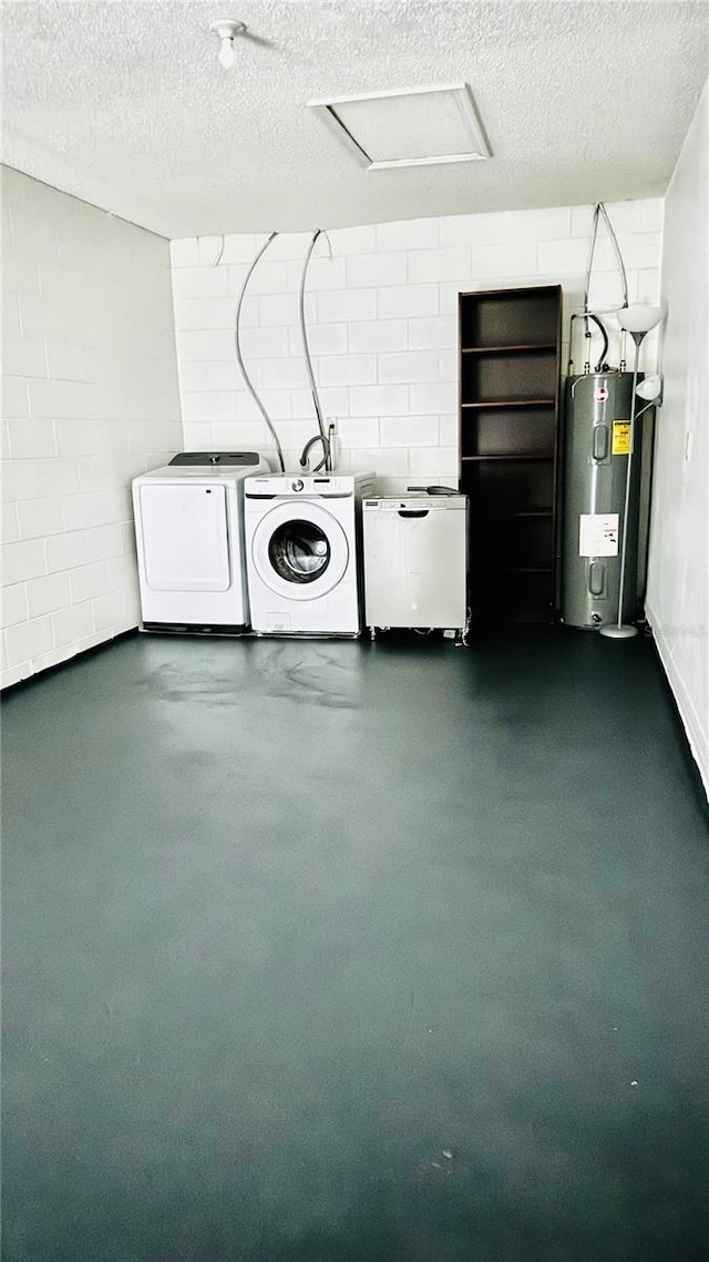 washroom featuring independent washer and dryer, a textured ceiling, and water heater