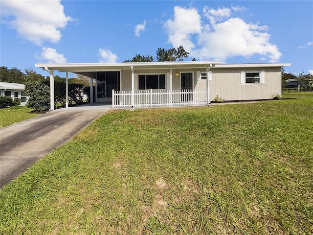 view of front of house with a carport, a porch, and a front lawn