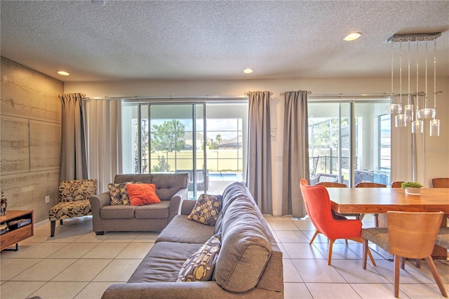 tiled living room featuring a textured ceiling