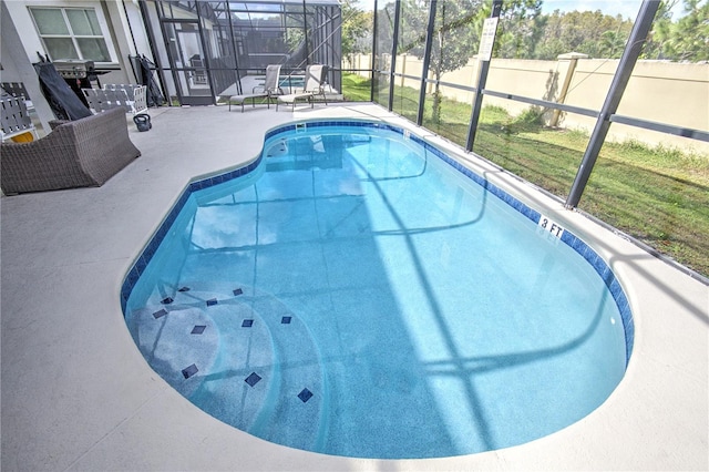 view of pool featuring a lanai, a patio, and a yard