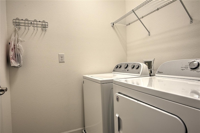 washroom with independent washer and dryer