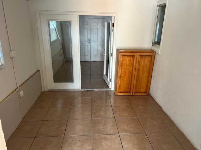 hallway featuring tile patterned floors