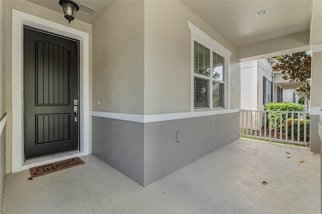 entrance to property with covered porch