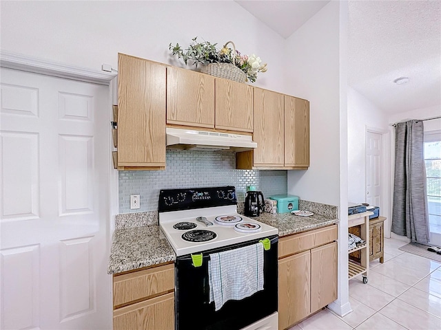 kitchen featuring light brown cabinets, backsplash, electric range, light tile patterned floors, and light stone counters