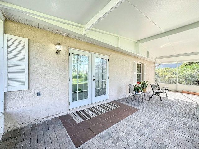 view of patio with french doors and a baseboard heating unit