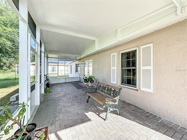 sunroom / solarium with lofted ceiling