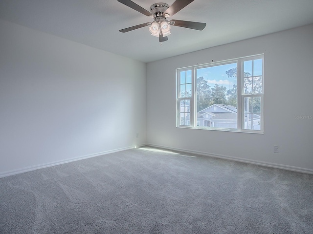 spare room with carpet flooring and ceiling fan