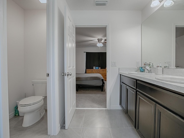 bathroom featuring tile patterned floors, ceiling fan, toilet, and vanity