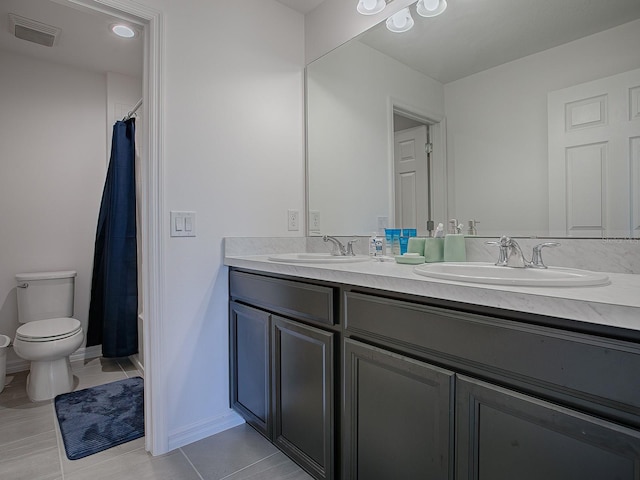 full bathroom with tile patterned floors, vanity, shower / tub combo, and toilet